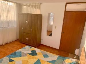 Ένα ή περισσότερα κρεβάτια σε δωμάτιο στο Yanahuara Habitacion Simple