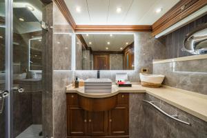 a bathroom with a sink and a shower at iRama Luxury Superyacht 6 Cabins & Hot Tub & Water Toys in Cannes