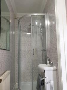 a bathroom with a shower and a sink at Room Stay - Marks tey, Colchester, United Kingdom in Marks Tey