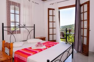 Postel nebo postele na pokoji v ubytování Paradeisos Rooms Pelion
