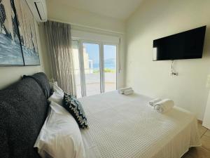 Katil atau katil-katil dalam bilik di Sunday Luxury Villa