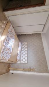 an overhead view of a bed in a room at Hay al matar nador in Nador