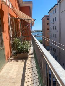 a balcony of a building with plants on it at Casa Mattei in Chioggia
