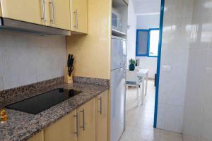 a kitchen with a sink and a counter top at La Avenida Las Nieves Agaete in Puerto de las Nieves