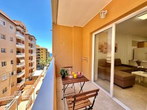 a balcony with a table and a couch at Vivienda Carolina in Santa Cruz de Tenerife