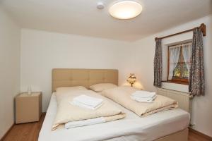 Postel nebo postele na pokoji v ubytování Alpen-Hotel Seimler
