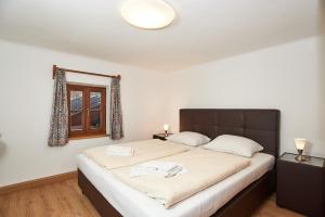 Postel nebo postele na pokoji v ubytování Alpen-Hotel Seimler