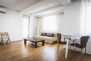 a living room with a couch and a table at Nice Apartment in Gevgelija