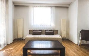 a living room with a couch and a table at Nice Apartment in Gevgelija