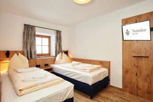 Postel nebo postele na pokoji v ubytování Alpen-Hotel Seimler
