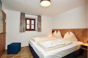 Postel nebo postele na pokoji v ubytování Alpen-Hotel Seimler