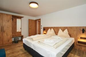 Postel nebo postele na pokoji v ubytování Alpen-Hotel Seimler