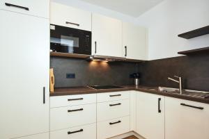 Kuchyň nebo kuchyňský kout v ubytování Alpen-Hotel Seimler