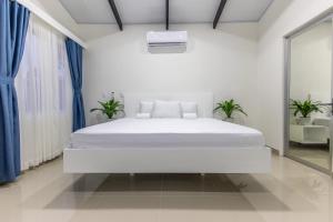 Кровать или кровати в номере The Zion Suite Tortuguero