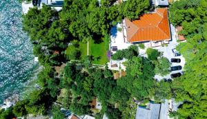 an overhead view of a house with a lot of trees at Candela, No 3 in Starigrad-Paklenica