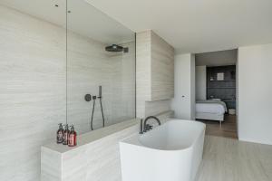 a bathroom with a white sink and a shower at Enso District Residences in Knokke-Heist +45 photos