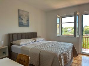 Ένα ή περισσότερα κρεβάτια σε δωμάτιο στο Apartman MARITA