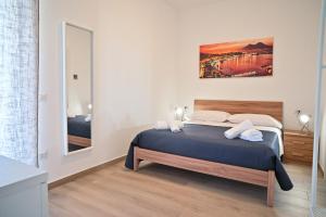 Postel nebo postele na pokoji v ubytování FRONTEMARE Suites