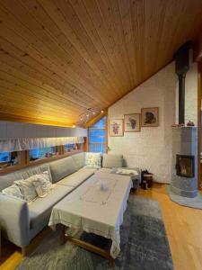 a living room with a couch and a fireplace at Top floor apartment with amazing view and location in Tromsø