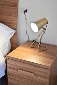 Letto o letti in una camera di FRONTEMARE Suites