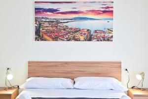 Letto o letti in una camera di FRONTEMARE Suites