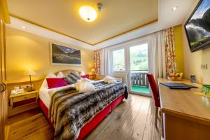Postel nebo postele na pokoji v ubytování Nationalparkhotel Klockerhaus