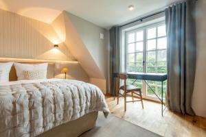 Un pat sau paturi într-o cameră la Landhaus Senwai 3