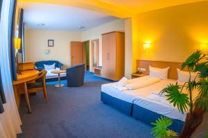 Postel nebo postele na pokoji v ubytování Hotel Wilder Mann