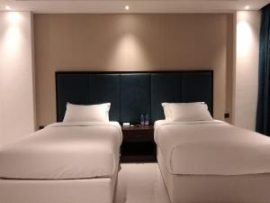 Letto o letti in una camera di Nebula Hotel