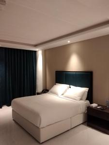 Postel nebo postele na pokoji v ubytování Nebula Hotel