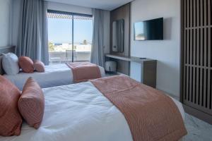 Postel nebo postele na pokoji v ubytování One Resort Premium Hammamet