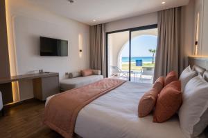 Postel nebo postele na pokoji v ubytování One Resort Premium Hammamet