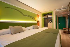 Postel nebo postele na pokoji v ubytování Hotel Magic Sports 4