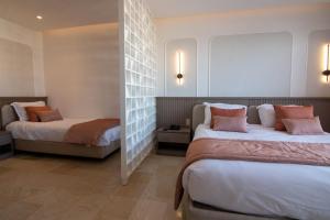 Postel nebo postele na pokoji v ubytování One Resort Premium Hammamet