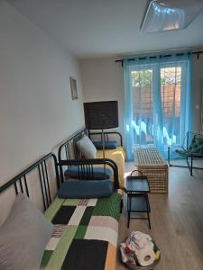 a living room with a bed and a couch at Amelie & Sea - Ground Floor Penthouse with 2 Terraces, Green Views, Sleeps 9 in Vir