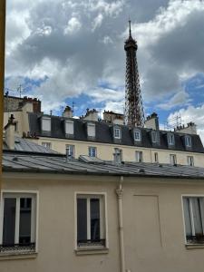 a building with a tower on top of it at Eiffel Playcation in Paris