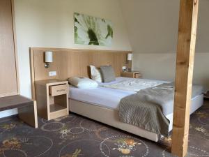 Postel nebo postele na pokoji v ubytování Flair-Hotel Neeth + 32 fotografií