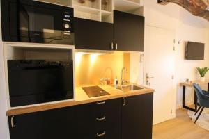 Η κουζίνα ή μικρή κουζίνα στο G5 Appartement Climatisé Centre Angouleme