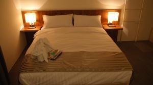 Rúm í herbergi á Bai Ji Yi B&B