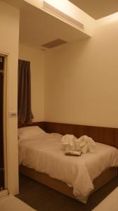 Rúm í herbergi á Bai Ji Yi B&B