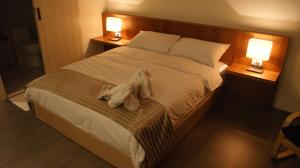 Rúm í herbergi á Bai Ji Yi B&B