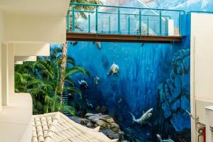 a wall mural of an aquarium in a building at HOVIMA La Pinta Beachfront Family Hotel in Adeje