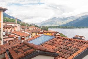 a view of a town with a swimming pool on the roofs at Tra il Borgo e il Lago in Lovere