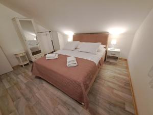 Postel nebo postele na pokoji v ubytování Apartment Queen