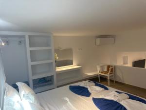 Postel nebo postele na pokoji v ubytování ENE’S Mýkonos