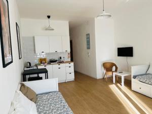 a room with a kitchen and a living room at Ciao Iglesias 3 in Iglesias
