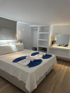 Postel nebo postele na pokoji v ubytování ENE’S Mýkonos + 37 fotografií