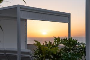a view of the sunset from the balcony of a house at HOVIMA Jardin Caleta in Adeje