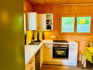 Kuchyň nebo kuchyňský kout v ubytování Stella's Holzchalet + 14 fotografií