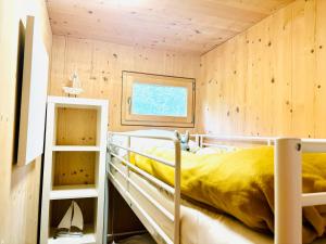 Postel nebo postele na pokoji v ubytování Stella's Holzchalet